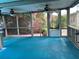 View of colorful flowering trees surrounding the screened-in patio area at 112 10Th St, St Cloud, FL 34769