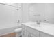 Bathroom featuring a shower and tub, a single sink, and white tile at 2007 Stetson Ave, Eagle Lake, FL 33839