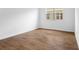 Clean, bright bedroom featuring tile floors and a large window that lets in plenty of natural light at 2007 Stetson Ave, Eagle Lake, FL 33839