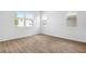 Clean, bright bedroom featuring tile floors and two windows that let in plenty of natural light at 2007 Stetson Ave, Eagle Lake, FL 33839