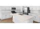 Bright, modern kitchen with stainless steel appliances and a large center island at 2007 Stetson Ave, Eagle Lake, FL 33839