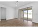 Spacious living room featuring tile floors, sliding glass doors to the lanai, and neutral paint at 2007 Stetson Ave, Eagle Lake, FL 33839
