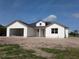 New construction shows a charming white home with an attached garage, and a dormer window detail at 3664 Cord Ave, St Cloud, FL 34772