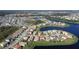 A wide aerial shot illustrating the community layout near the water, featuring meticulously cared-for residences at 3960 Steer Beach Pl, Kissimmee, FL 34746
