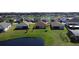 Expansive backyard showcasing several homes and a tranquil pond, ideal for enjoying the outdoors at 3960 Steer Beach Pl, Kissimmee, FL 34746