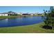 Beautiful backyard homes overlooking a tranquil pond, perfect for relaxation and enjoying waterfront views at 3960 Steer Beach Pl, Kissimmee, FL 34746