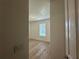 Cozy bedroom with wood laminate flooring and a large window at 3960 Steer Beach Pl, Kissimmee, FL 34746