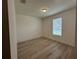 Bright bedroom with wood laminate flooring and a window at 3960 Steer Beach Pl, Kissimmee, FL 34746