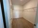 Walk-in closet with carpet flooring and wire shelving, providing ample storage space at 3960 Steer Beach Pl, Kissimmee, FL 34746