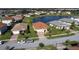 Inviting single-Gathering home featuring lush landscaping, brick driveway, and a picturesque neighborhood setting at 3960 Steer Beach Pl, Kissimmee, FL 34746