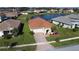 Charming single-Gathering home boasts a well-manicured lawn, brick driveway, and lovely landscaping at 3960 Steer Beach Pl, Kissimmee, FL 34746