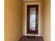 Elegant front door with decorative glass, enhancing the home's curb appeal and entry experience at 3960 Steer Beach Pl, Kissimmee, FL 34746
