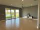 Bright living room with tile floors, ceiling fan, and sliding glass doors overlooking the water at 3960 Steer Beach Pl, Kissimmee, FL 34746