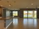 Open living space with granite counters and view of the lake at 3960 Steer Beach Pl, Kissimmee, FL 34746