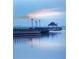 Picturesque pier with gazebo extending into calm waters, reflecting a peaceful atmosphere at 3960 Steer Beach Pl, Kissimmee, FL 34746