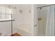 Bright bathroom with a soaking tub, separate shower, and natural light from a window at 4758 Wyresdale St, Orlando, FL 32808