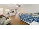 Bedroom featuring a comfortable bed, dresser, and a cozy sitting area at 4758 Wyresdale St, Orlando, FL 32808