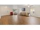 Bright living room with wood floors, comfortable seating, and natural light at 4758 Wyresdale St, Orlando, FL 32808