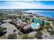 Aerial shot of the community pools and tennis courts nestled amongst the neighborhood at 224 Valencia Ridge Dr, Auburndale, FL 33823