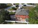Aerial view of the home's backyard, fencing, and neighborhood at 438 Spike Ct, Kissimmee, FL 34759