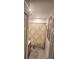 Compact bathroom featuring a patterned shower curtain and neutral-toned walls, creating a functional space at 438 Spike Ct, Kissimmee, FL 34759