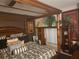 Bedroom features a four-post bed frame, decorative pillows and linens, and unique wall decor at 438 Spike Ct, Kissimmee, FL 34759