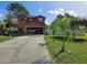 Charming two-story home with a spacious driveway, attached garage, and lush green lawn at 438 Spike Ct, Kissimmee, FL 34759