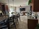 Modern kitchen with granite countertops, breakfast bar, stainless steel appliances, and an open living space at 438 Spike Ct, Kissimmee, FL 34759