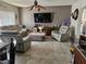Inviting living room features tile floors, comfortable seating, TV, and stylish decor at 438 Spike Ct, Kissimmee, FL 34759