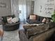 Cozy living room showcasing comfortable seating, decorative pillows, and stylish decor at 438 Spike Ct, Kissimmee, FL 34759