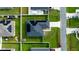 Aerial view of house with solar panels and well-manicured lawn at 464 Bridgewater Ct, Kissimmee, FL 34758