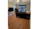 Bright bedroom with large windows, hardwood floors and a TV at 464 Bridgewater Ct, Kissimmee, FL 34758