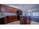 Kitchen with island and dark wood cabinets at 464 Bridgewater Ct, Kissimmee, FL 34758
