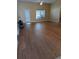 Spacious living room featuring hardwood floors and lots of natural light at 464 Bridgewater Ct, Kissimmee, FL 34758