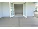 View of the open doors leading to the balcony with composite decking at 13193 Tollcross Way, Winter Garden, FL 34787
