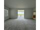 Spacious bonus room with sliding doors providing access to the balcony, and a gorgeous view beyond at 13193 Tollcross Way, Winter Garden, FL 34787