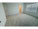 Bedroom with neutral carpeting, a large window, and closet access at 13193 Tollcross Way, Winter Garden, FL 34787