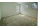 Spacious bedroom featuring neutral carpeting and three large windows at 13193 Tollcross Way, Winter Garden, FL 34787
