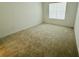 Cozy bedroom with neutral carpet and bright window at 13193 Tollcross Way, Winter Garden, FL 34787