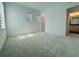 Spacious bedroom featuring neutral carpeting and an en-suite bathroom at 13193 Tollcross Way, Winter Garden, FL 34787