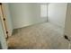 This bedroom is complete with neutral carpeting and a large window at 13193 Tollcross Way, Winter Garden, FL 34787