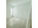 A cozy and bright bedroom with tile floors and a window at 13193 Tollcross Way, Winter Garden, FL 34787