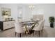 Beautiful dining room boasting a marble table, elegant chairs, and refined decorations at 13193 Tollcross Way, Winter Garden, FL 34787