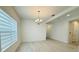 Bright dining room featuring a modern chandelier and horizontal blinds at 13193 Tollcross Way, Winter Garden, FL 34787