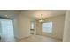 Open concept dining area with chandelier, with view into butler's pantry at 13193 Tollcross Way, Winter Garden, FL 34787