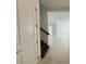 Hallway with stairs and view into the living area at 13193 Tollcross Way, Winter Garden, FL 34787