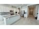 Modern kitchen with stainless steel appliances, granite countertops, and white cabinetry at 13193 Tollcross Way, Winter Garden, FL 34787
