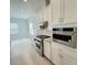 Contemporary kitchen with stainless steel appliances and modern fixtures at 13193 Tollcross Way, Winter Garden, FL 34787