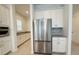 Well-equipped kitchen with stainless steel refrigerator and sleek countertops at 13193 Tollcross Way, Winter Garden, FL 34787
