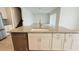 Kitchen island featuring stainless steel dishwasher, granite countertops, and white cabinets at 13193 Tollcross Way, Winter Garden, FL 34787